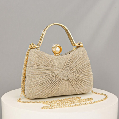 A charming, feminine handbag from Opole Aura, luxurious and elegant, adorned with sequins and a romantic bow, featuring a rhinestone-studded case. Perfect for evening events, weddings, or as a shoulder bag, it